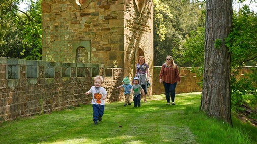 Children exploring the gothic folly 'Stainborough Castle' at Wentworth Castle Gardens